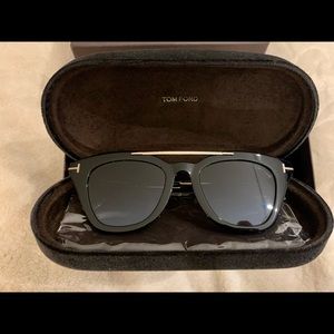 Women Tom Ford black gradual lens with gold hardware sunglasses.